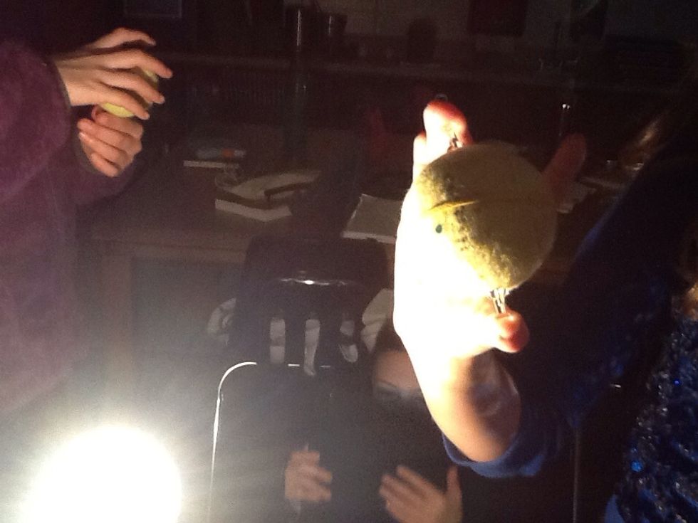 Here we did an experiment on the tilt  and we stuck two tac's in a tennis ball  and got a light ball and we moved around the light.