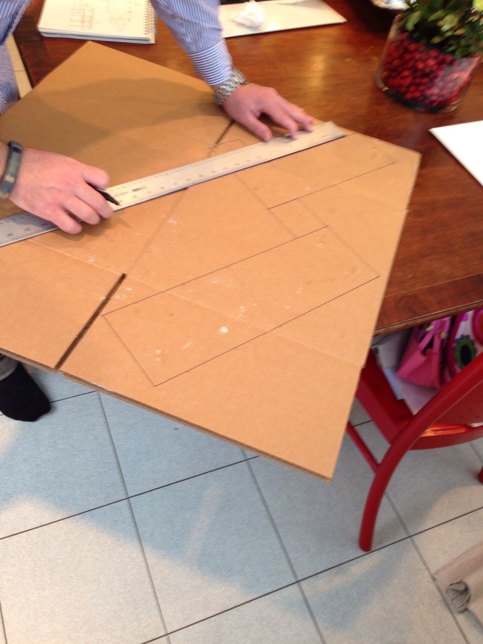 Here we go! More measuring and straight lines! Did I mention Throckmorton is an engineer? They love this stuff. And math. This is going to be the base for the house.