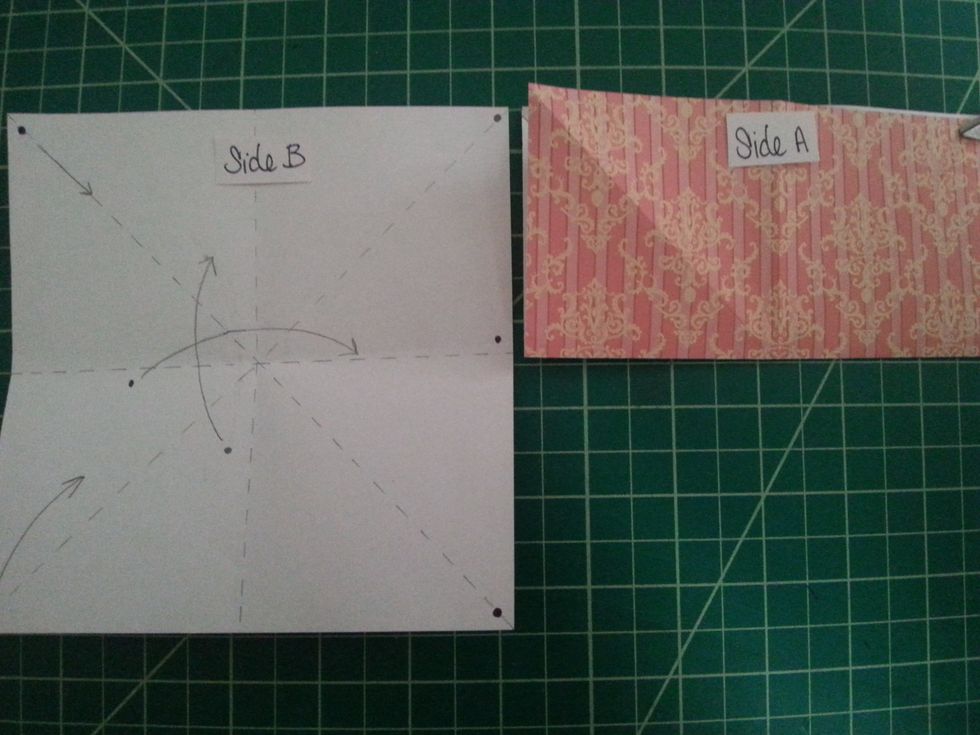 Here we'll do a Mountain Fold, unfold the paper, we'll take the bottom of the paper & fold it to meet the top (both corners are marked with dots). End shape should match shape on right.