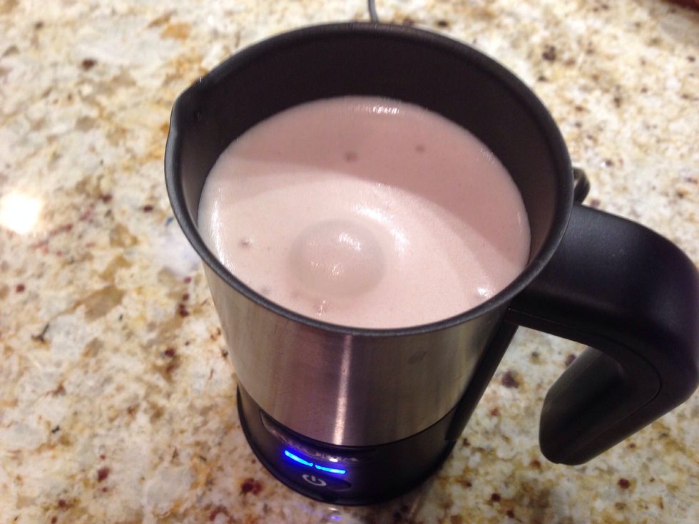 Here we're frothing chocolate flavored skim milk using the heat setting for hot chocolate froth.