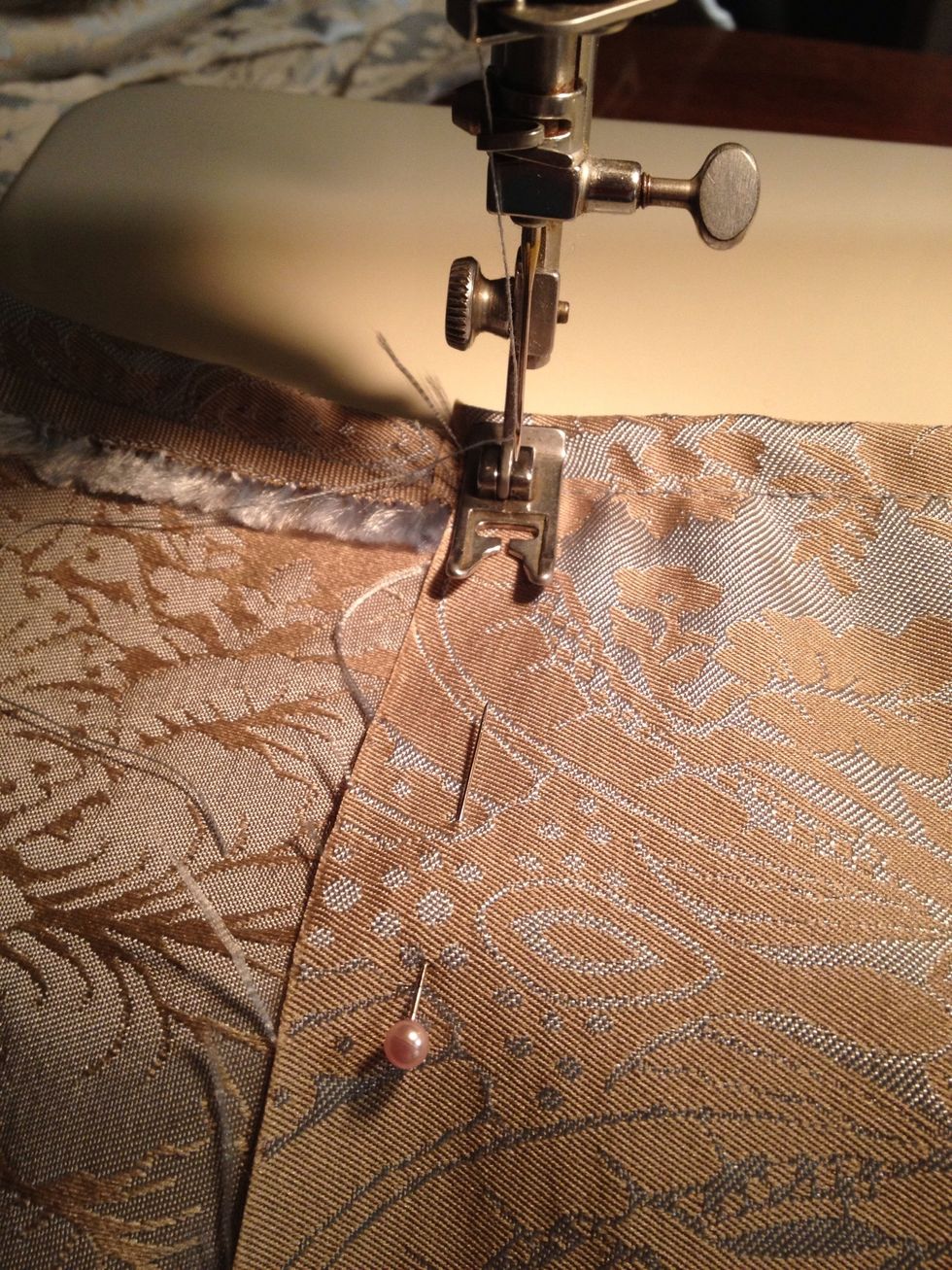 Here you can see I have already sewn the sides 1 inch folded over and sew on the 1/2 inch line. (Or fold it over twice so no frayed edges show).