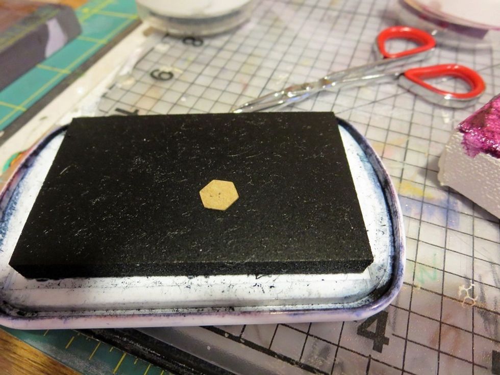 Hex-shaped Imbedibles were colored by dipping them into various ink pads.