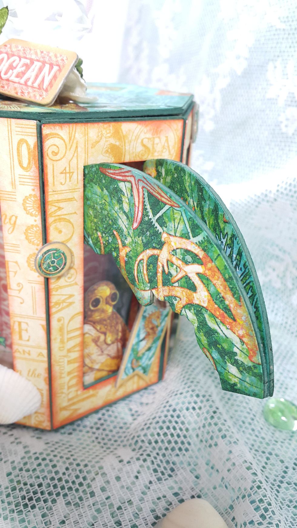 Hiding a diving man at the back of the window, looking at who are going to open it, ha!