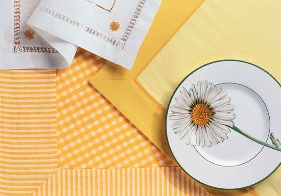 High-quality dinnerware is like a little black dress-- perfect for any occasion. Changing just a few accessories transforms the look. With bright linens, the cheery daisy evokes spring and summer.