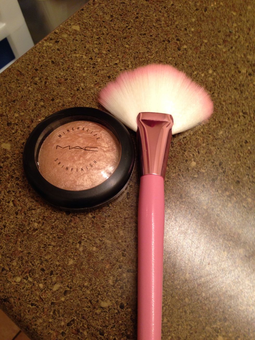 Highlight above cheekbones.