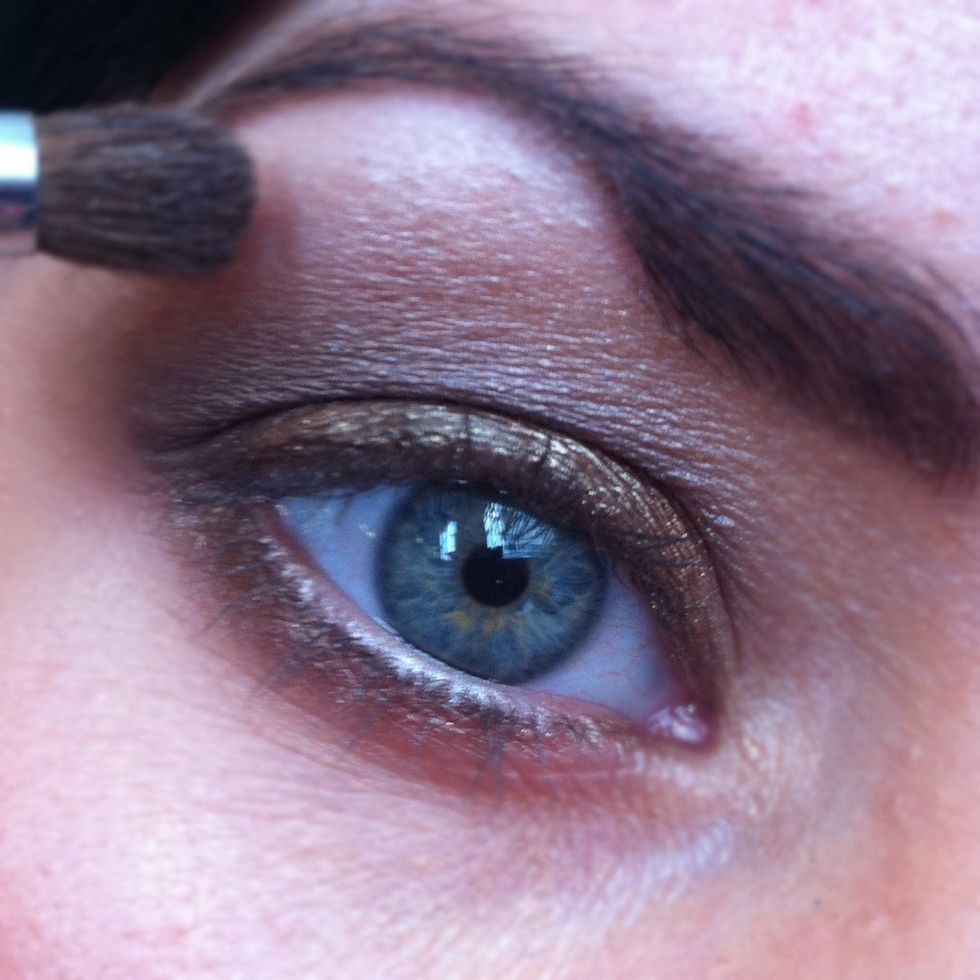 Highlight your brow bone with a blending brush and a shimmery white eyeshadow.