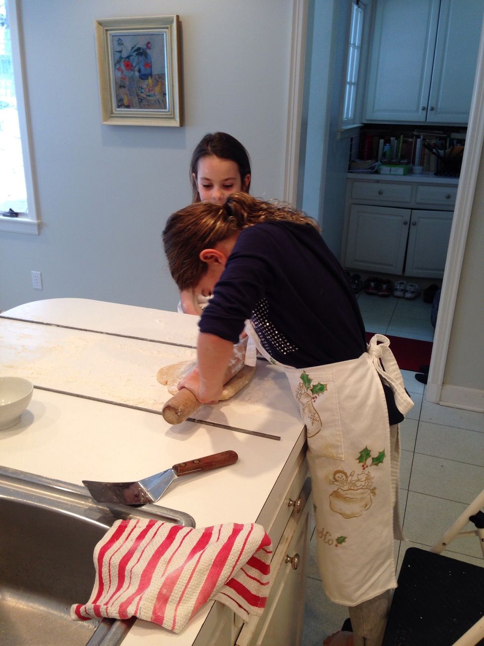 Hildegard is rolling. See how the pin is going to sit on those steel things and make perfectly even dough? Genius, really.