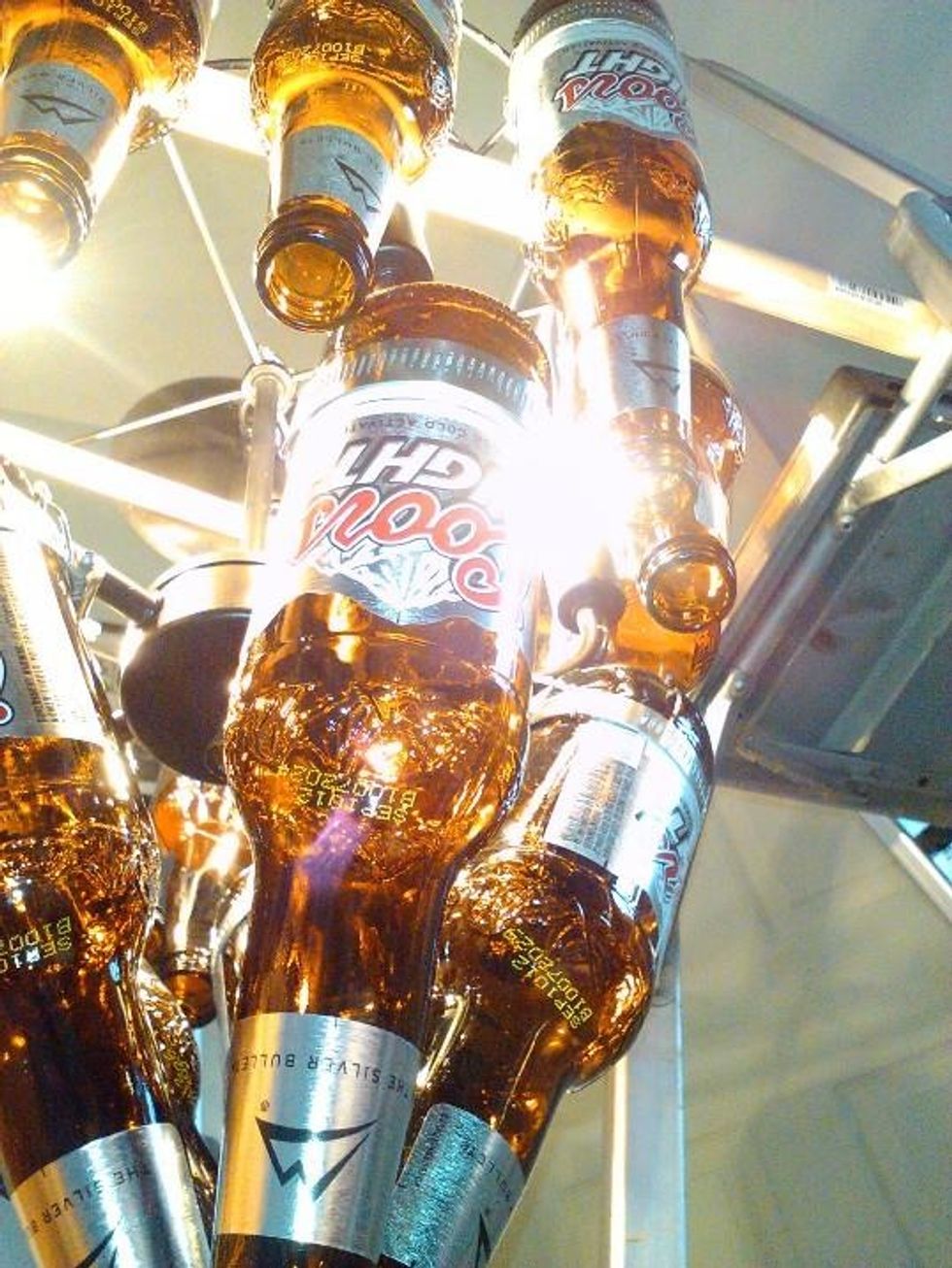 HINTS: I used wooden dowels and ladders to hang my project while installing bottles.