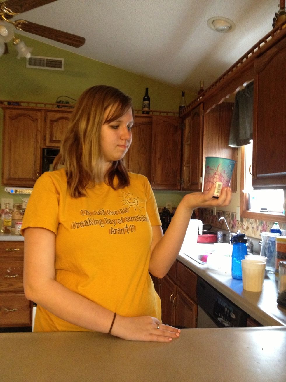 Hit the bottom of the cup against the palm of your hand.