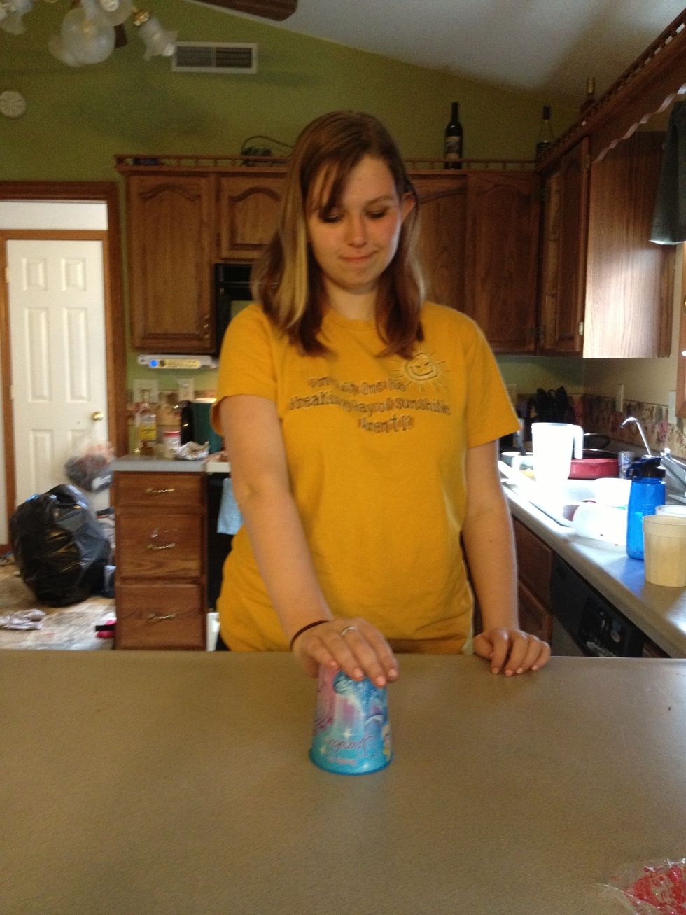 Hit the cup against the counter...and VIOLA!!! Add the words, put it all together, speed it up a bit and that's it!!!