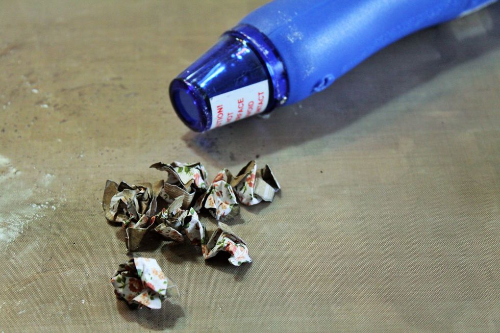 Hit the flowers with an embossing gun to dry.