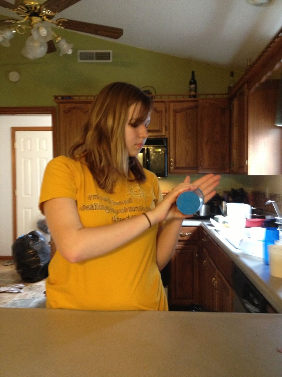 Hit the open part of the cup against the palm of your hand