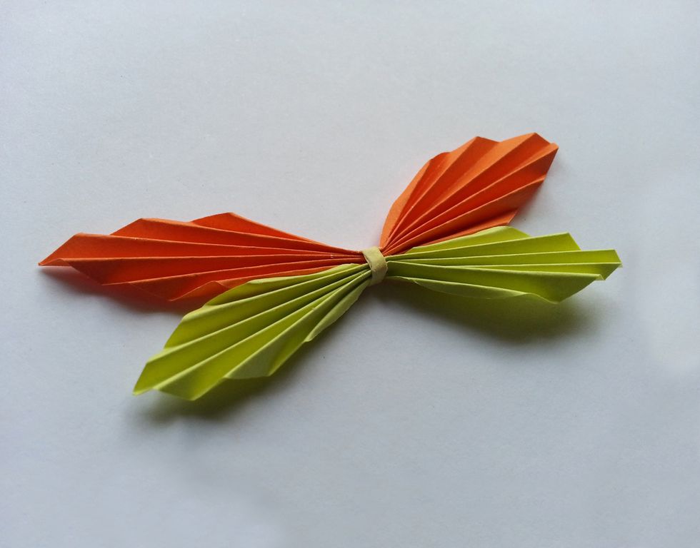 Hold both wings together and the neatly wrap it around the center of the wings.