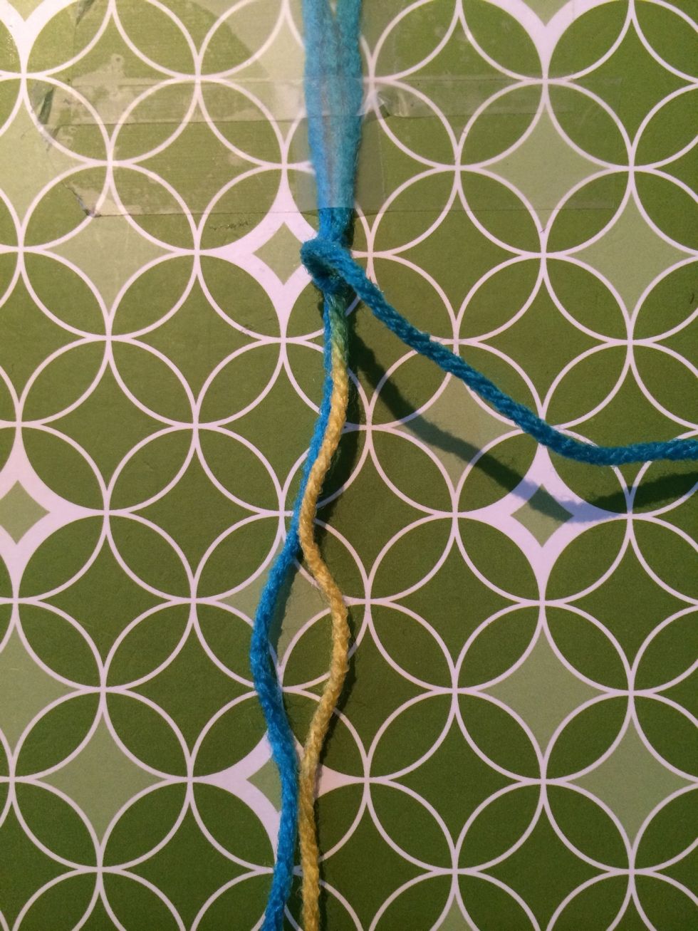 Hold down the other strings and pull your first one all the way up.