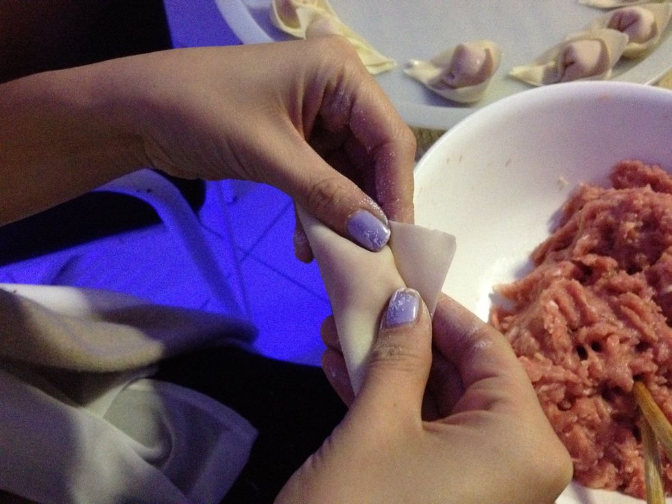 Hold down these two sides and tuck them in a bit into the side of the mince
