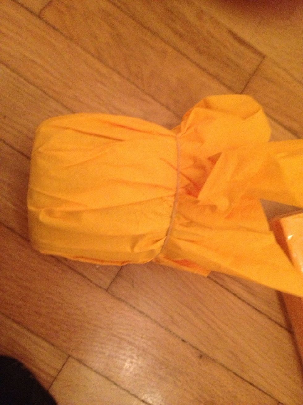 Hold it with the cord.