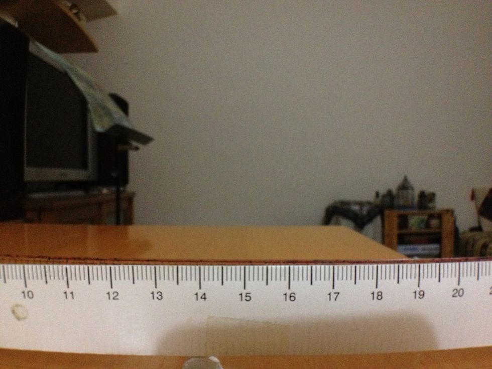 Hold lens in front of camera at max distance from phone. Move left & right to make sure the length augmented on both sides are the same. 9.3 & 20.7 ie 0.7 augmented on both sides for real