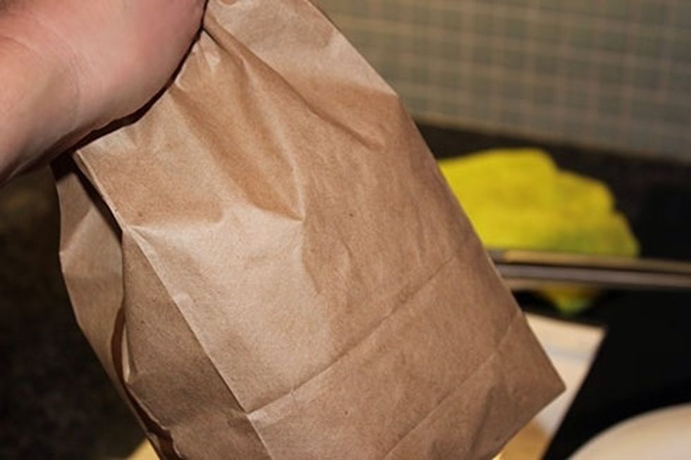 Hold the bag around the stem, making it as airtight as possible. Then give the bag a really good shake.