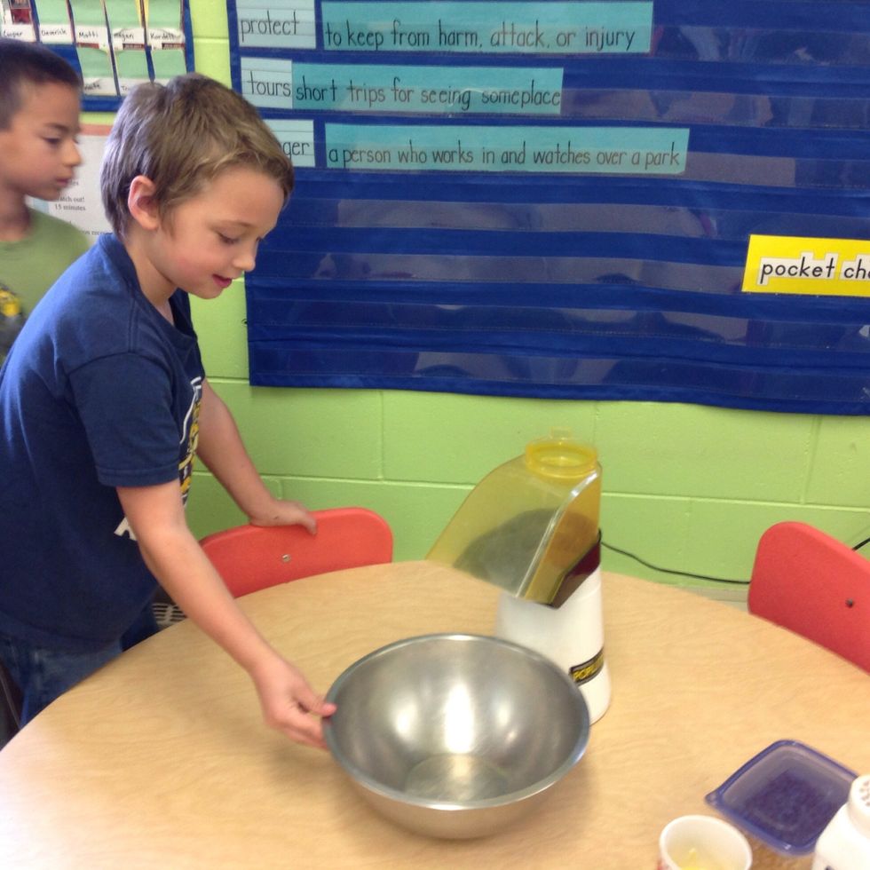Hold the bowl under the shoot.
