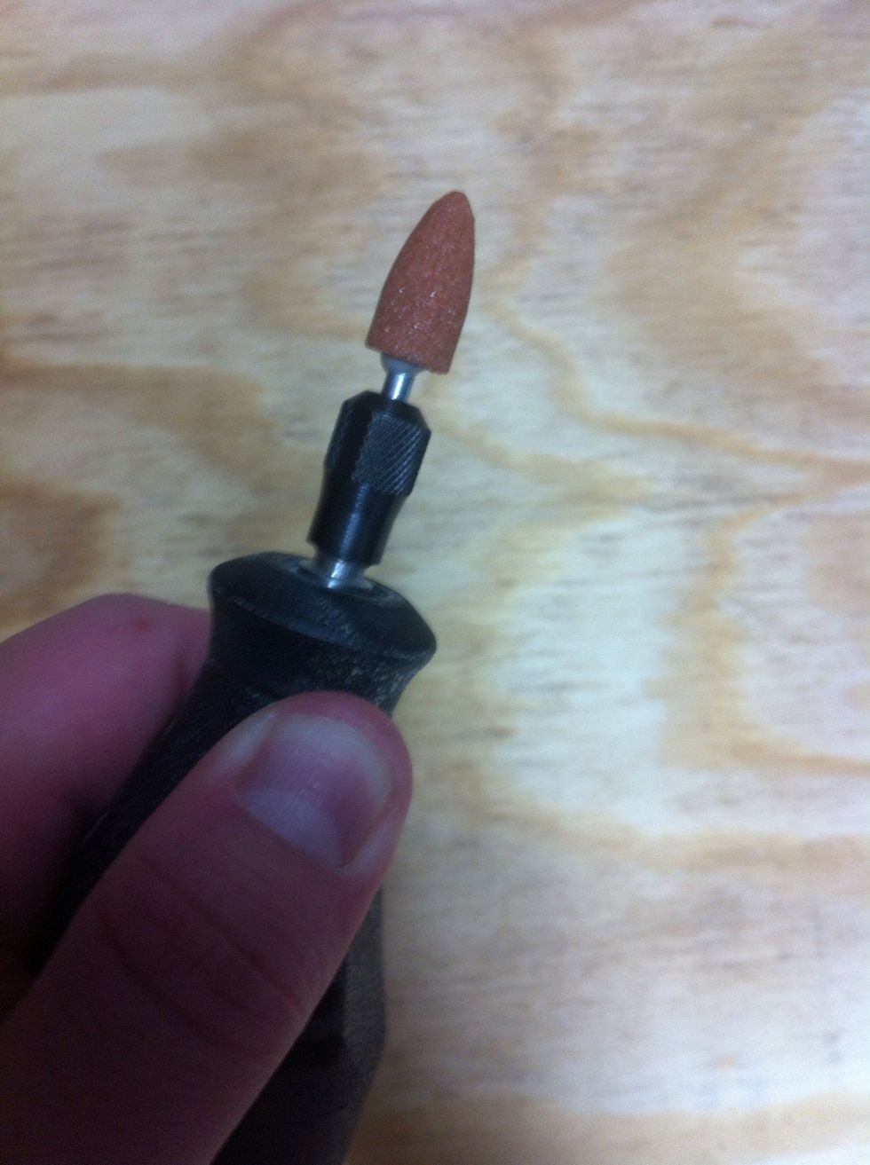 Hold the button to lock the neck and provide resistance while twisting the neck.