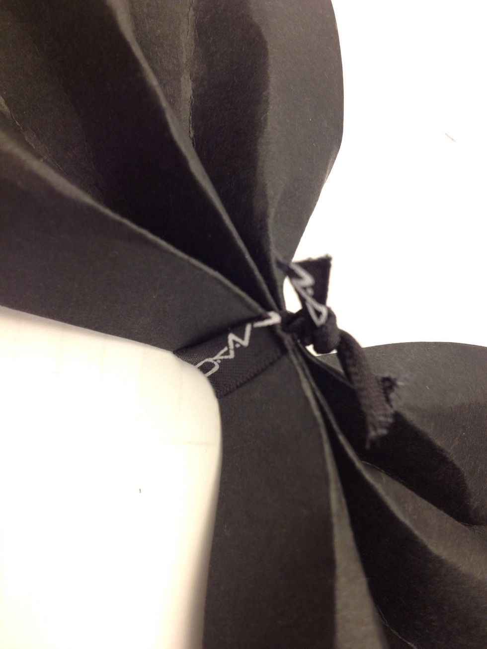 Hold the centre and tie a ribbon, can be any color to match