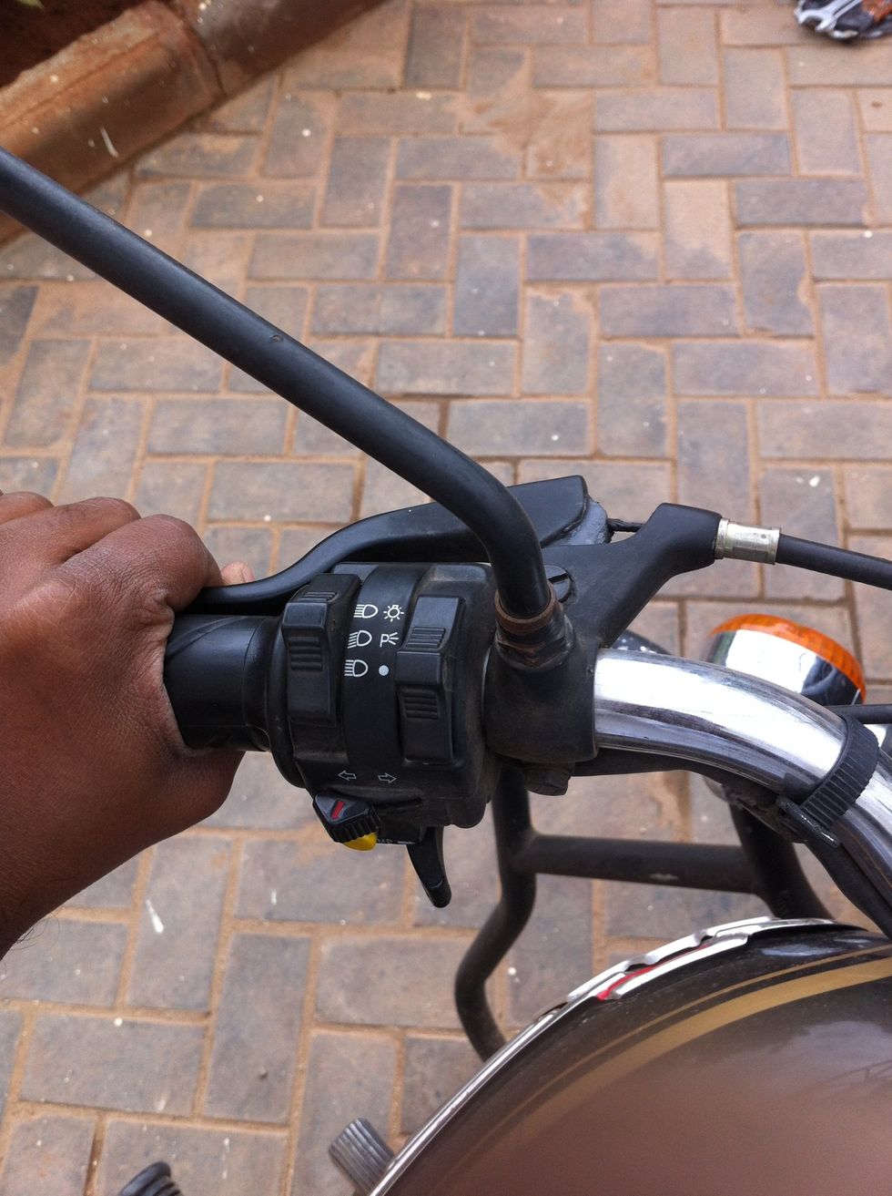 Hold the clutch lever to help you get more access to the locknut in the gearbox