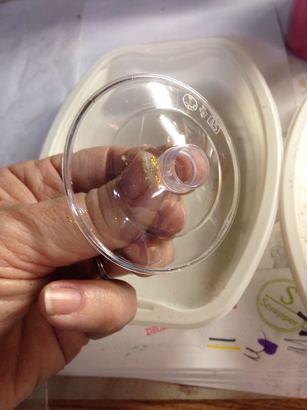 Hold the glass base underneath...