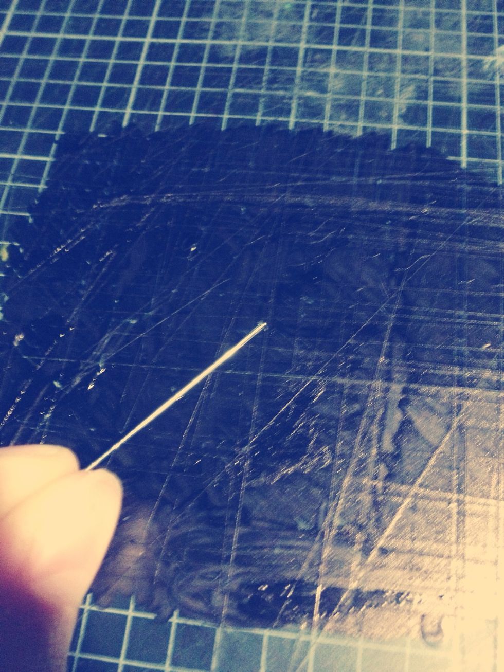 Hold the headpin in your fingers, taking note of which end has the flat stopper so the beads don't fall off.