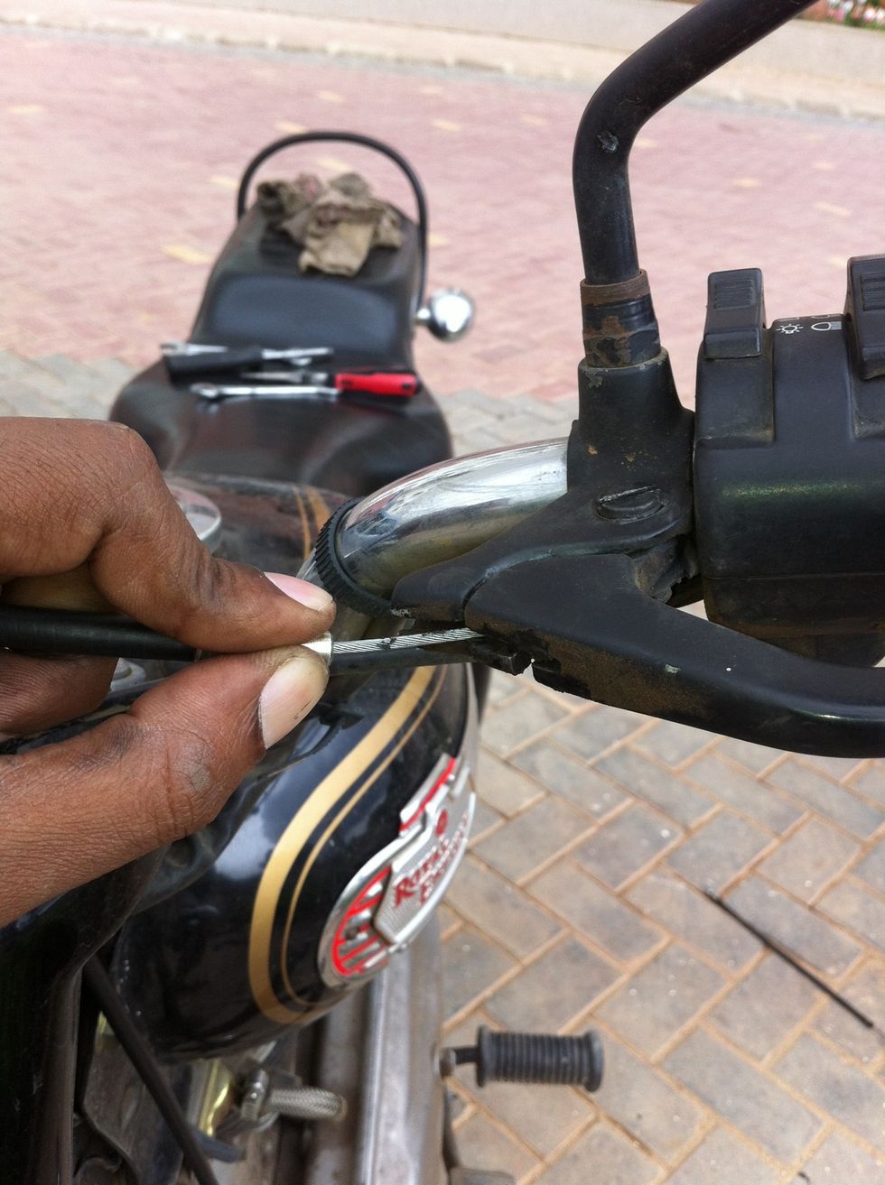 Hold the seating and guide the cable through the slots