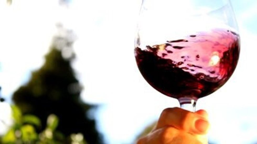 Hold the stem of the wine glass & give it a swirl. If the wine is just swooshing back & fourth, relax your wrist & lead w/ your pinky. Swirling the wine releases the aromas & allows it to breathe.