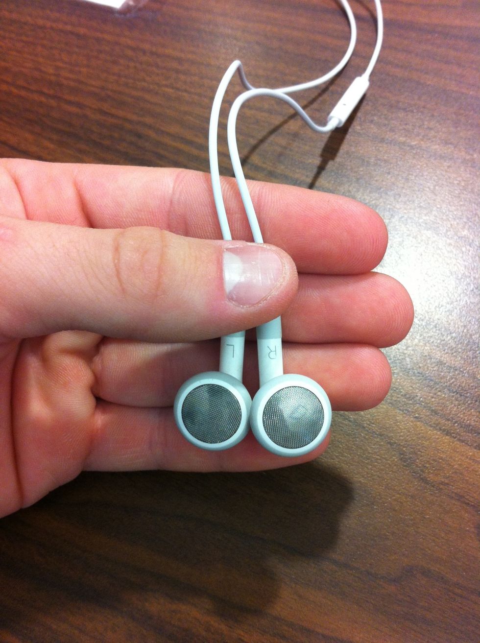 Hold the two earbuds against your fingers. Depending on the size, shape and parts (read: microphone) of your earbuds, you may want to start at different points.