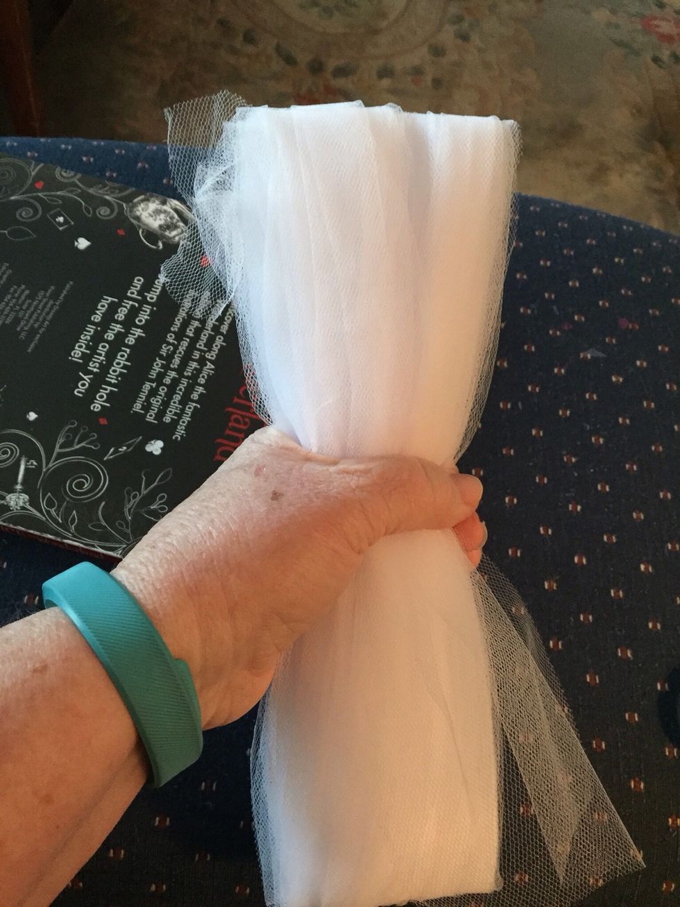 Hold tulle in the middle...
