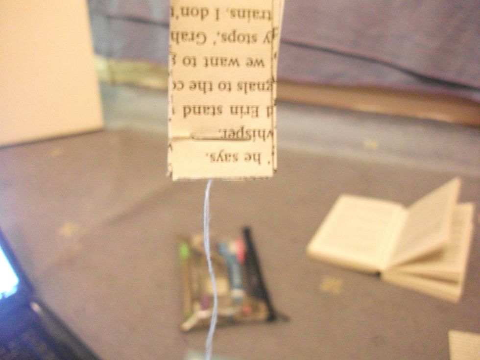 Hold upside down and you may need to just move the thread out of the way for a minute.