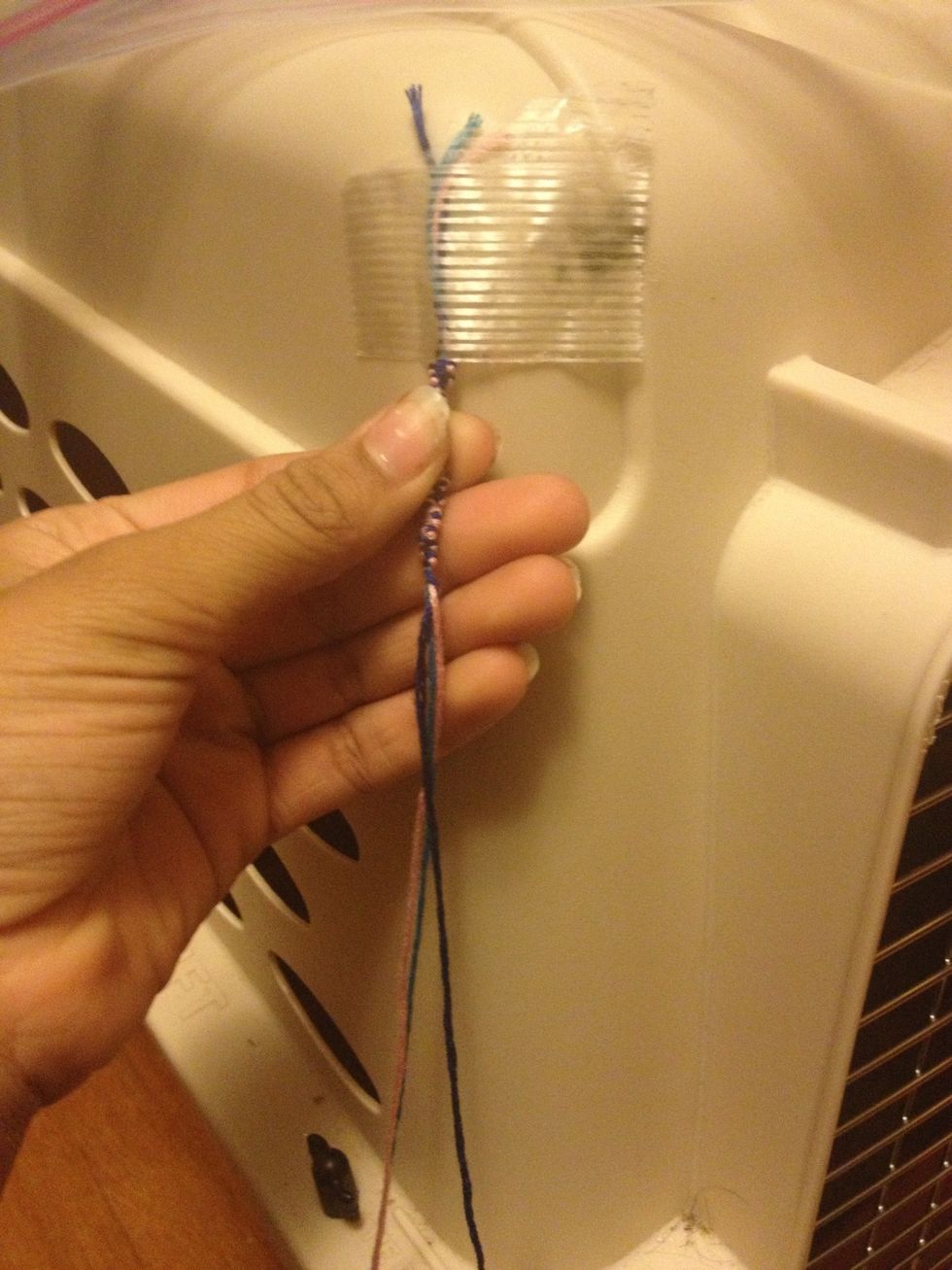 Hold your bracelet and carefully slide it down so it looks almost like a snake