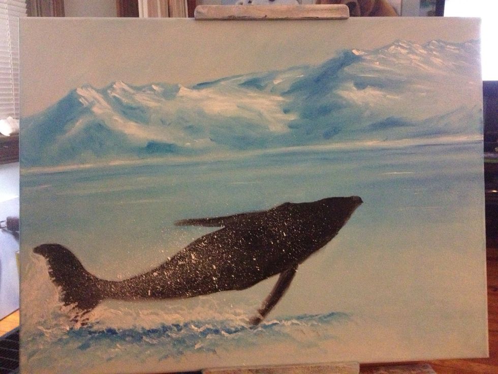 Hold your palette knife in one hand, and run your fan brush over the edge to spring white onto the canvas.