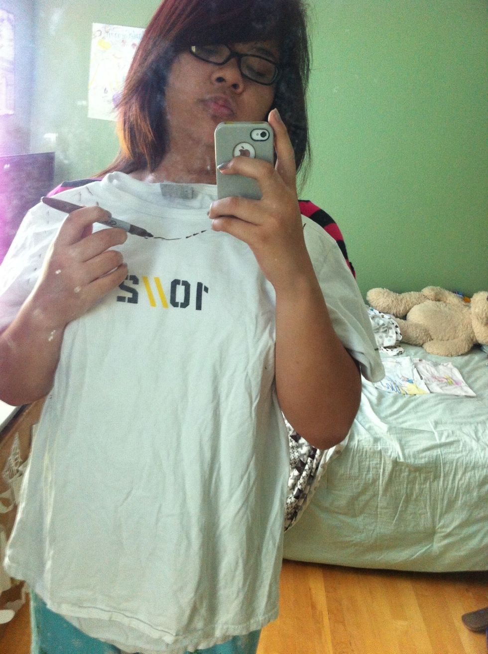 Hold your shirt up to your body and mark where the neckline will be.You can skip to step 3 if you're happy with the shirt's neckline.