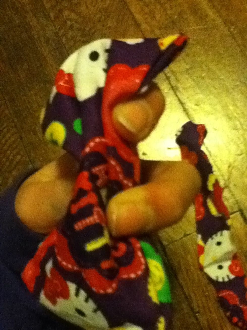 Hold your squished fabric like this and put a dot of glue there