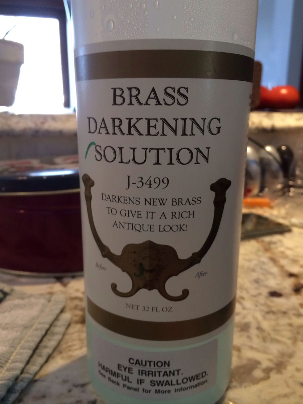 Holding knob by non-brass parts to avoid fingerprints, clean with an acetone soaked cotton ball. Dip in Brass Darkening solution (Rockler).