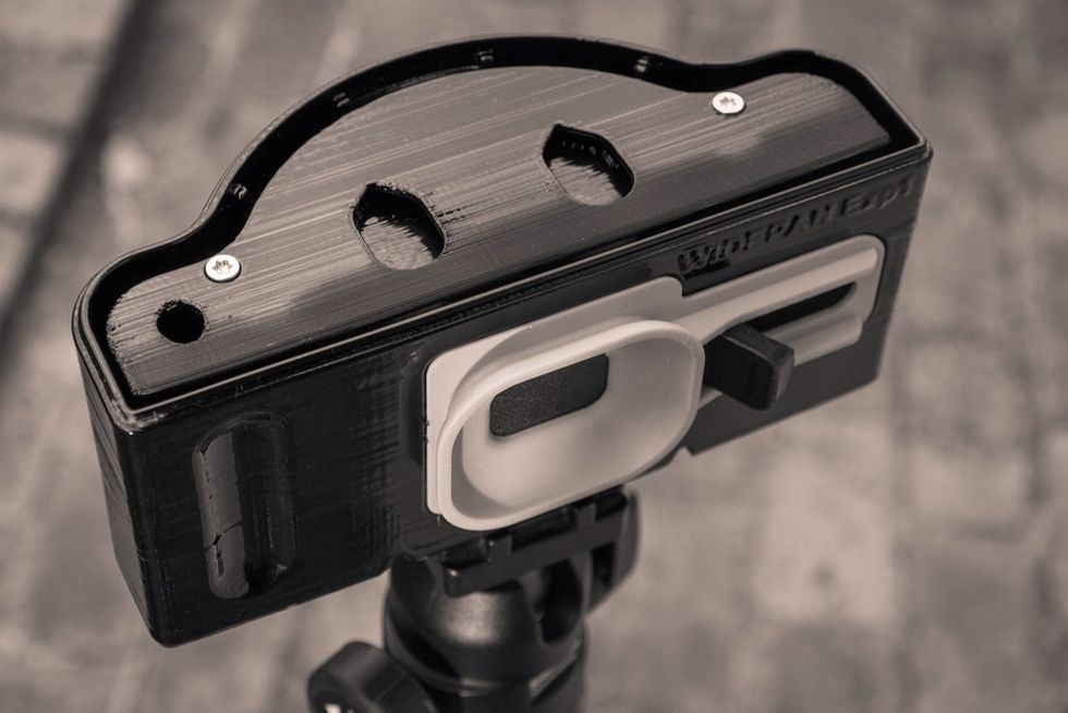 Hole details in curved film plane avoid inserting part upside down into main body.