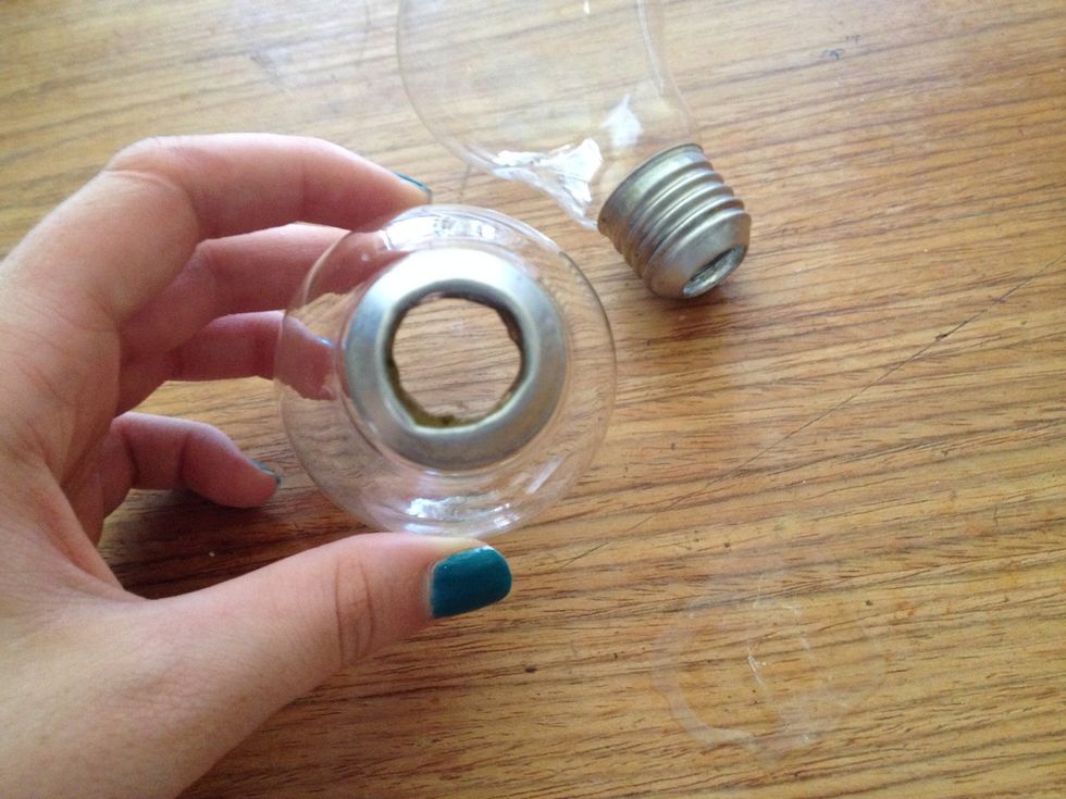 Hollow out both lightbulbs using your pliers and screwdriver. Be very careful as you are using sharp glass.