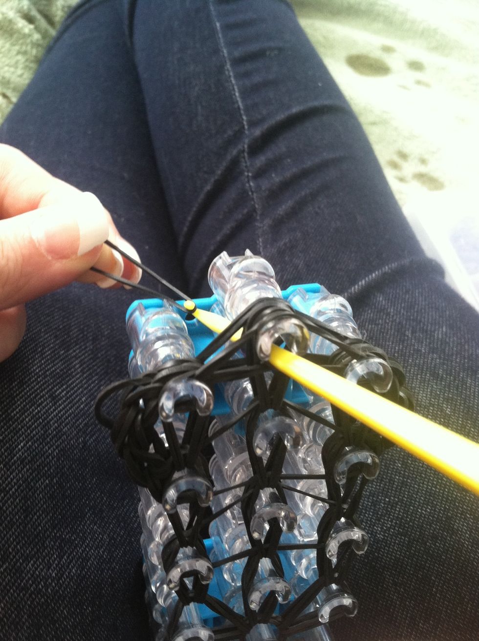 Hook another rubber band though it.