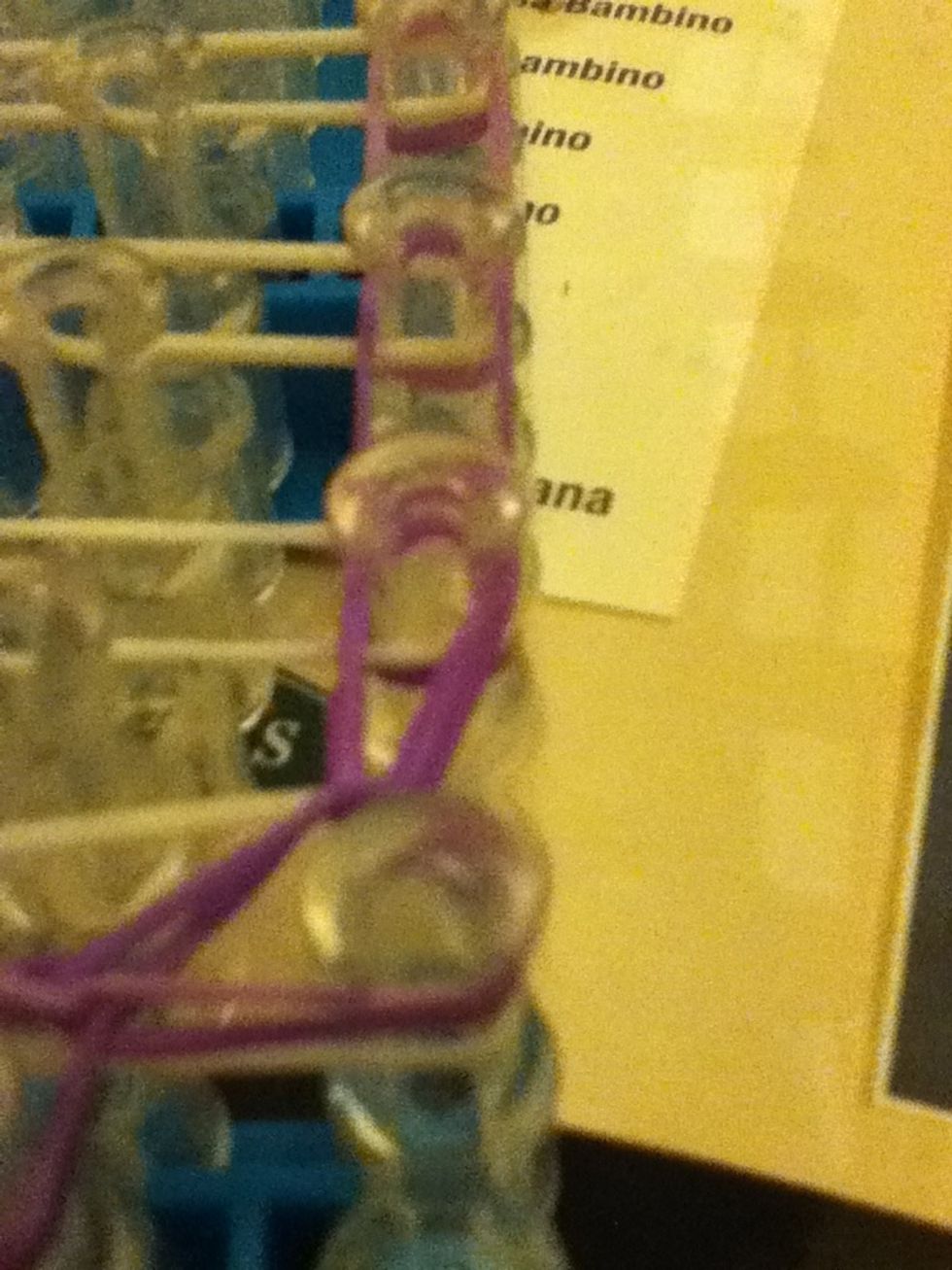 Hook it with the next band. Do the same step with the other side and continue till the end