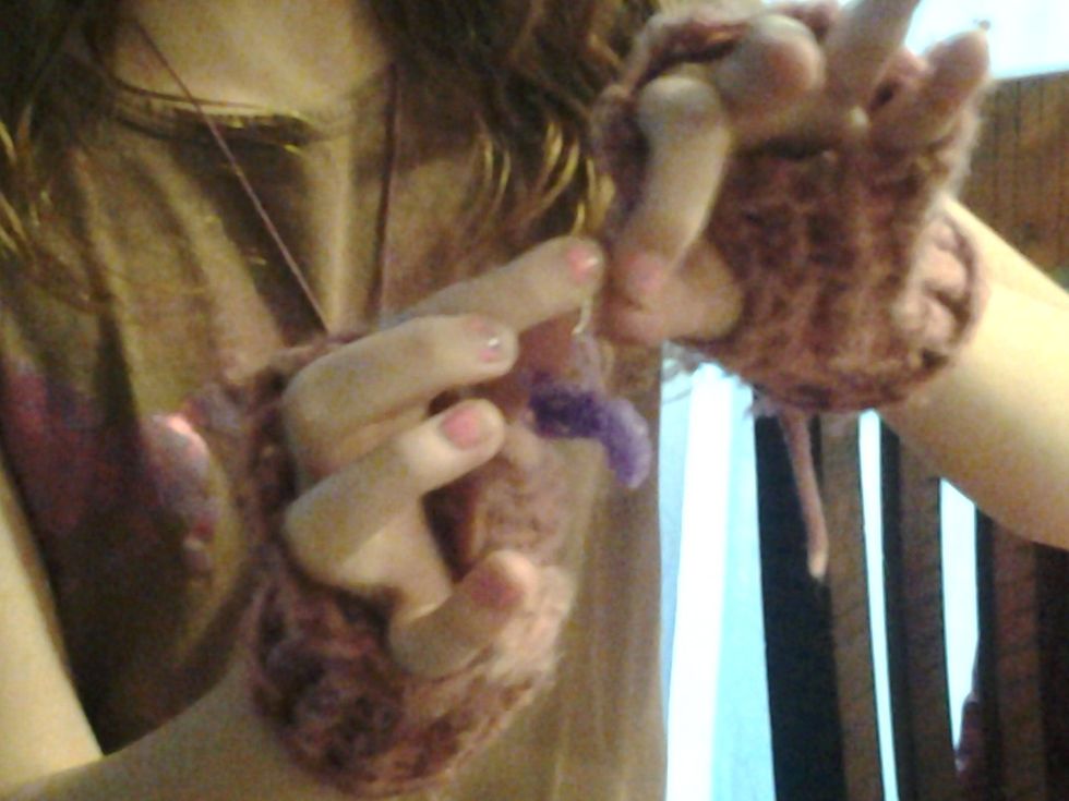 Hook the charms on the hooks if you can't get it have a adult help.