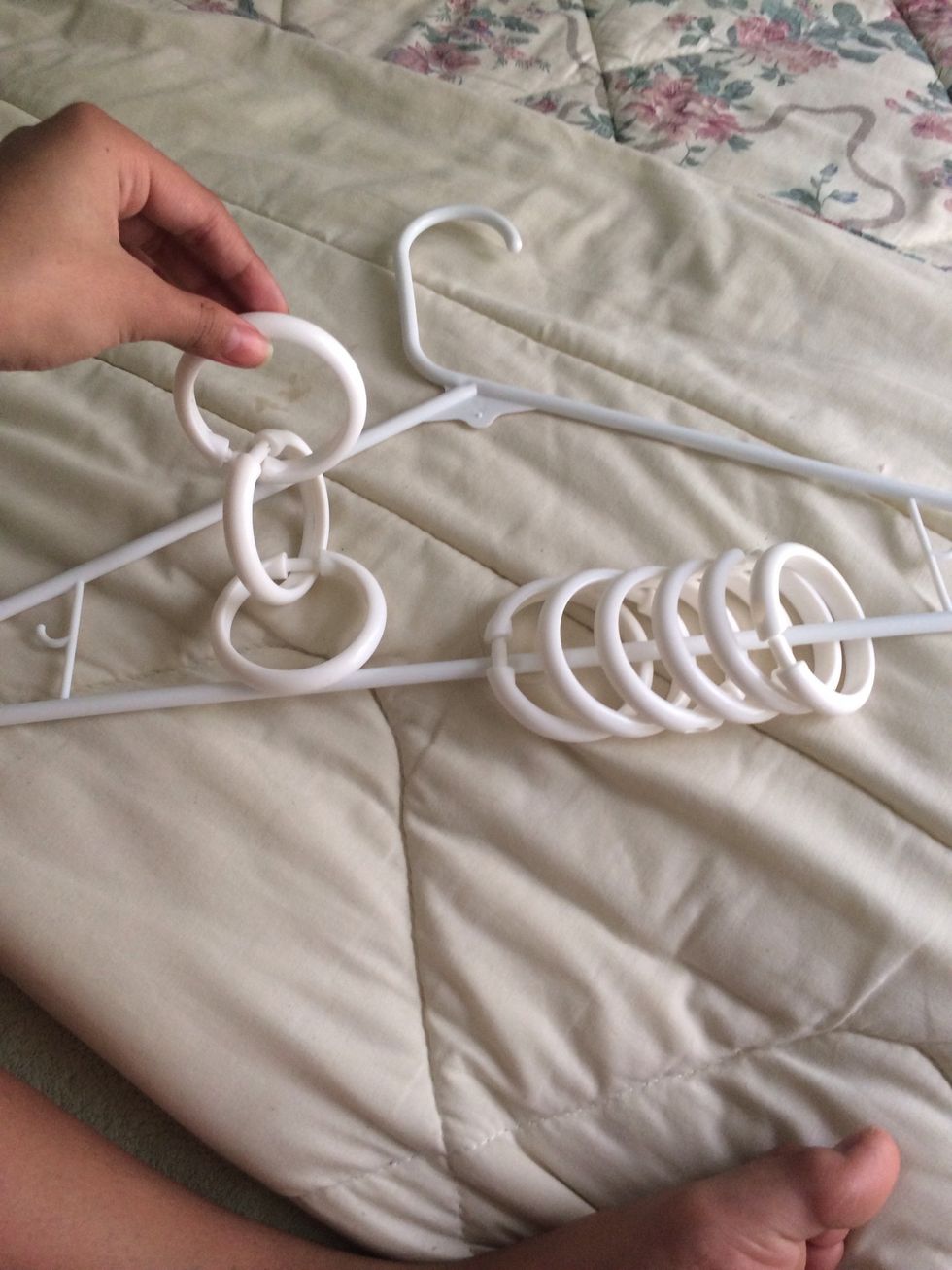 Hook the shower rings to the hanger. If you have a hanger the same as mine put one shower ring on each side with the bars so the scarf with be balanced.