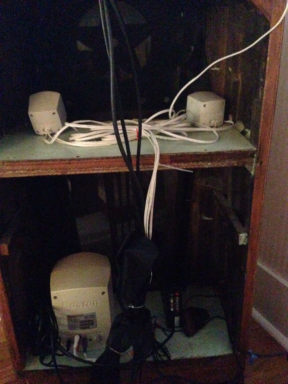 Hook up Roku player and speakers up to the TV. Use staple gun and zip ties to organize wires. Plug the electronics into the extension cord or power strip.