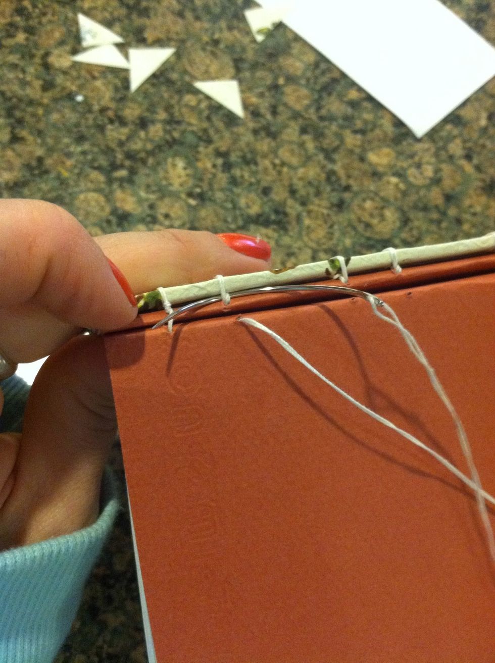 Hook your needle under the thread above the station you are on pull tight.