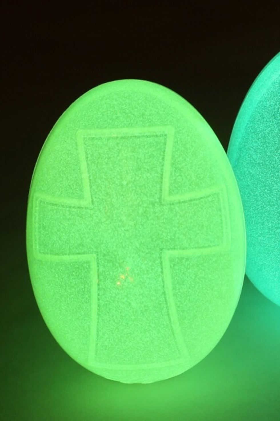 Hot glue Glow-in-the-Dark Egglo Eggs evenly around the wreath, alternating colors.