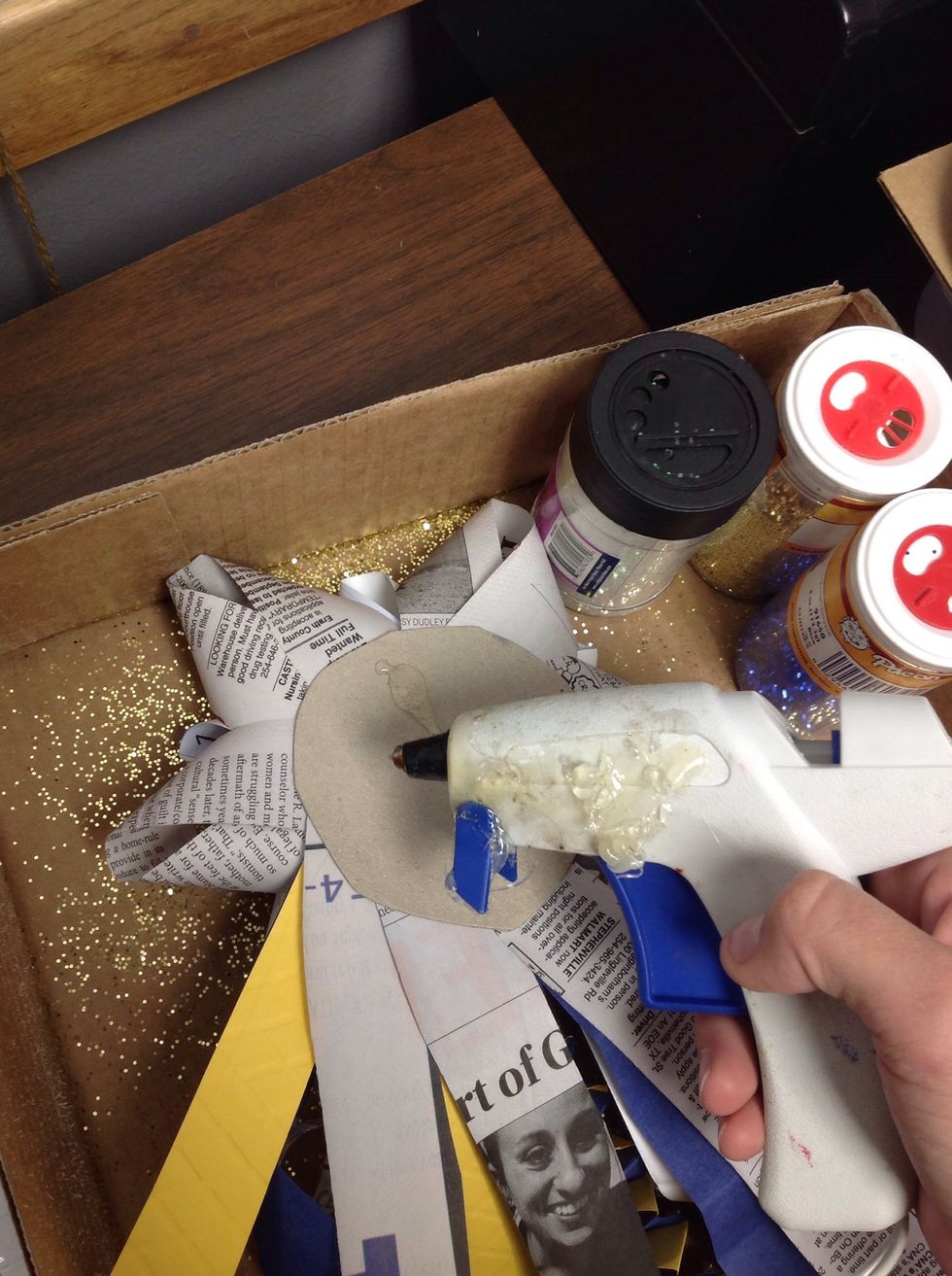 Hot glue near top of mum, on the back.