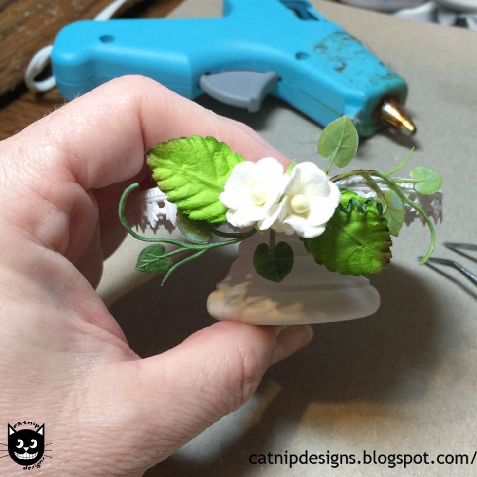 Hot glue one more 1 Inch Mulberry Paper Rose Leaves to the other side as shown.