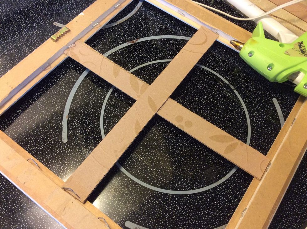 Hot glue or staple strips to frame.